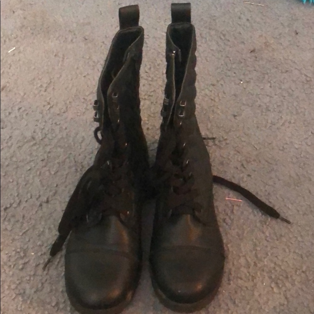 Slightly worn black combat boots